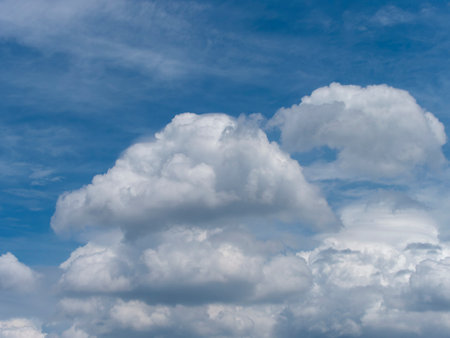 Summer blue sky and white clouds background materialの写真素材