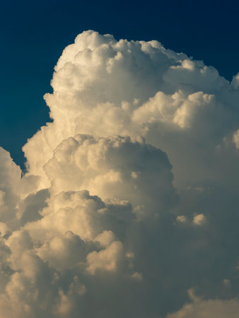 Cumulonimbus clouds rising in the twilight skyの写真素材