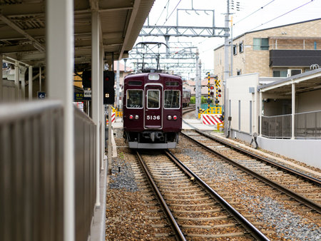 Train passing through stationの写真素材