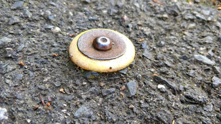 Detail view on leveling point hammered into concrete pavement.