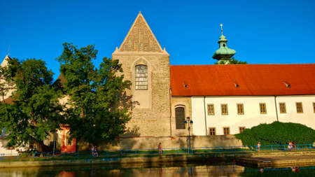Ceske Budejovice, Czech Republic - July 12, 2021: Medieval monastery building with beautiful red...