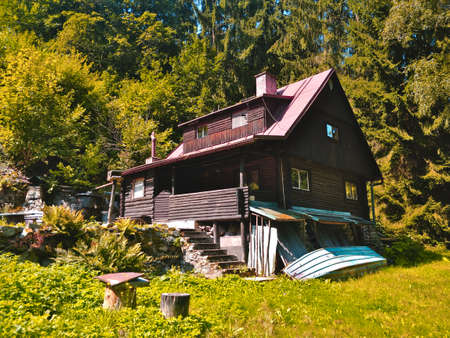 Stechovice, Czech Republic - Wooden recreational cottage built next to the Stechovice dam and surrounding forest.のeditorial素材