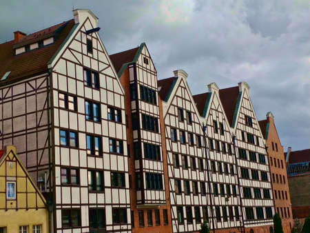 Gdansk, Poland - August 26, 2021: Detail view of old traditional Gdansk city center houses with...