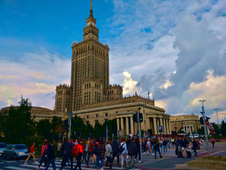 Warsaw, Poland - August 29, 2021: Palace of culture and science with a lot of people rushing through...