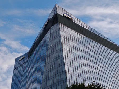 Warsaw, Poland - August 28, 2021: Big glass corner office building with modern design during...