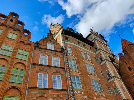Gdansk, Poland - August 26, 2021: Traditional old town houses made of red bricks in the Danzig city center.のeditorial素材