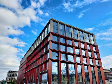 Gdansk, Poland - August 27, 2021: Unfinished modern style office building made of glass and steel in Gdansk outskirts during beautiful summer weather.のeditorial素材