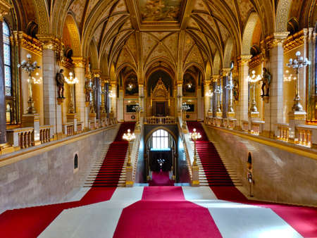 Budapest, Hungary - April 10, 2022: Main entrance staircase of the Budapest parliament building with red carpet and exactly 96 stairs.のeditorial素材