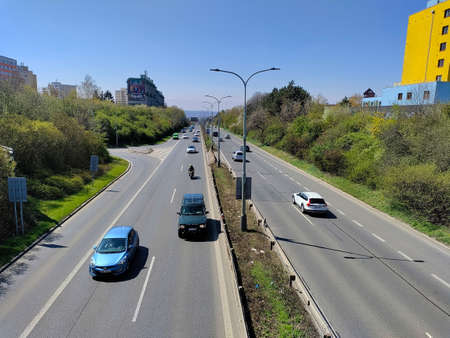Prague, Czech Republic: April 23, 2022 - Two line highway full of cars seen from the bridge. The road is straight and the sky in the background is blue.のeditorial素材