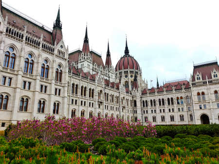 Budapest, Hungary - April 9, 2022: Budapest parliament building with flowers in the foreground.のeditorial素材