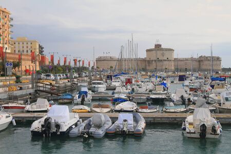 Yacht port and ancient fortress. Civitavecchia, Italyの写真素材