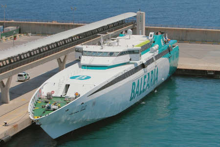 Ibiza, Spain - Jul 03, 2019: High-speed mooring ferry at portのeditorial素材