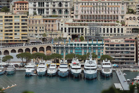 Monte Carlo, Monaco - Apr 19, 2019: Yacht parking and city on seashoreのeditorial素材