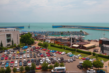 Adler, Sochi, Russia - Jul 07, 2022: Car parking, embankment, port on Black Seaのeditorial素材