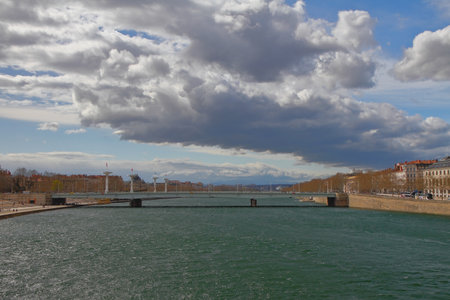 River, bridge and town in early spring. Lyon, France