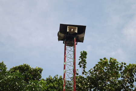Speaker on high tower and clear skyの写真素材