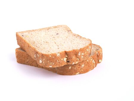 Sliced whole grains bread isolated on white background.の写真素材