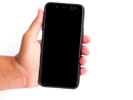 Hand holding smartphone isolated on white background.の写真素材