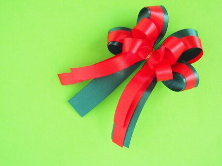  Christmas bow on green background.Holidays celebration concept.の写真素材