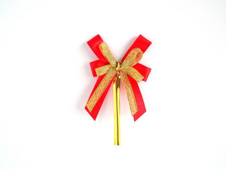  Red and gold ribbon bow isolated on white background.の写真素材