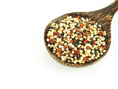 Mixed Quinoa in wooden spoon isolated on white background.の写真素材