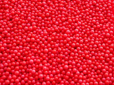 Close up small red foam balls background texture.の写真素材