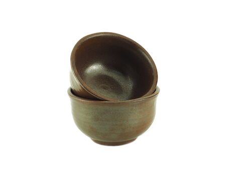Empty brown bowl stack isolated on a white background.の写真素材