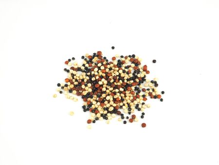 A pile organic tri-color Quinoa isolated on a white background. High fiber, Superfood.の写真素材