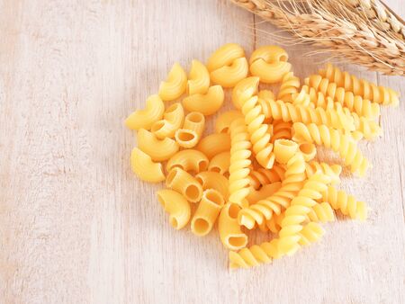  A pile of Italian pasta on white wooden table background.の写真素材