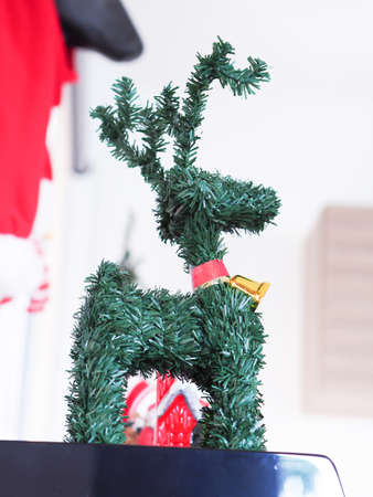 Reindeer pine tree ornament Christmas in living room, winter holiday.の写真素材