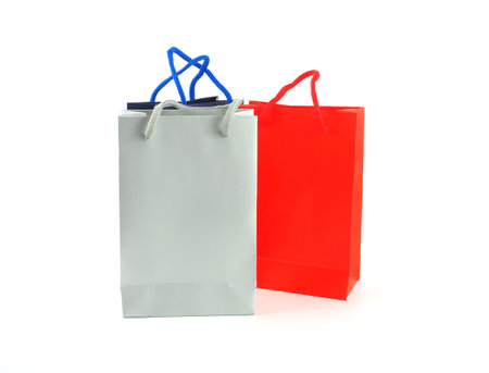 Paper shopping bags (grey, red, blue) isolated on white background, with space for your text.の写真素材