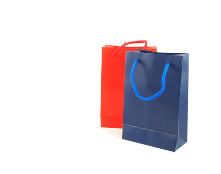 Paper shopping bags (red, blue) isolated on white background, with space for your text.の写真素材