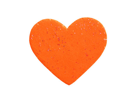 Orange heart shape made of foam isolated on a white background.  Concept for love and encouragement.の写真素材