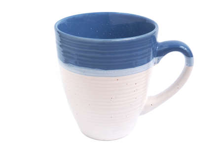 The empty beige and blue color (two tone) of coffee or tea mug isolated on a white background. Drink design concepts.の写真素材