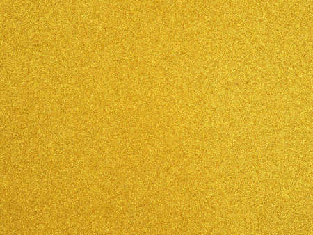 Golden yellow glitter color paper empty background texture for design.の写真素材