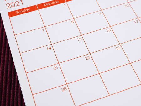 2021 calendar background, focus on 14th on the table. The concept Valentine's Day, anniversary, and wedding. Colse up with copy space for text.の写真素材