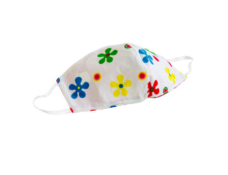 Flower pattern fabric face mask to prevent pollution and viruses. DIY handmade from cotton muslin isolated on white background. Healthcare and New normal concept. Copy space for your text.の写真素材
