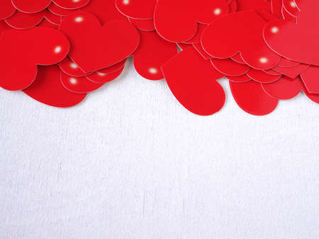 Red heart on white wooden background. Concept love, greeting card, banner, poster. Colse up with copy space for text.の写真素材