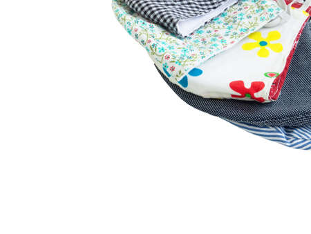 A pile of multi colored of fabric face mask isolated on a white background. Concept of coronavirus...