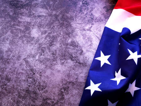 The beautiful fabric American flag on a grey background. Memorial Day or 4th of July. Copy space for your text.の写真素材