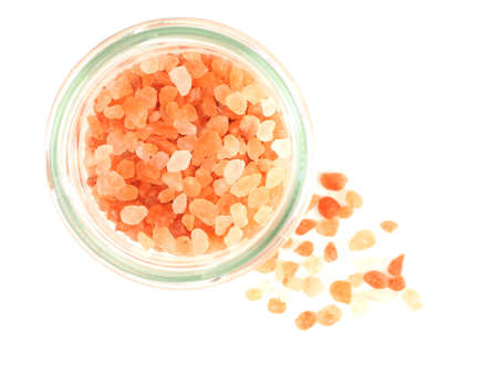 Top view, Himalayan pink salt in glass bottle isolated on a white background.の写真素材