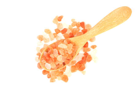 Flat lay, Top view of himalayan pink salt in wooden spoon isolated on a white background.の写真素材