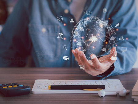 Global online transaction connection. Businessman holding a virtual globe icon showing global internet connection of banking transactions online shopping searching for information and big databaseの写真素材
