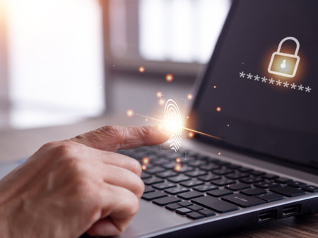 Businessman scan fingerprint on the virtual screen to laptop and biometric identity. The concept future of security and password control through fingerprints.の写真素材
