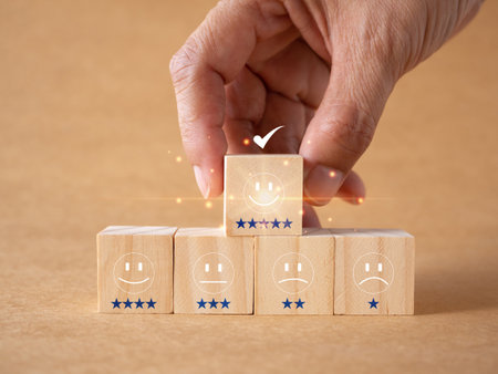 Customer service and Satisfaction Rating Concept. Customers choose a five-star smiley face block or the best service on a brown background. Ratings for high-quality product or serviceの写真素材