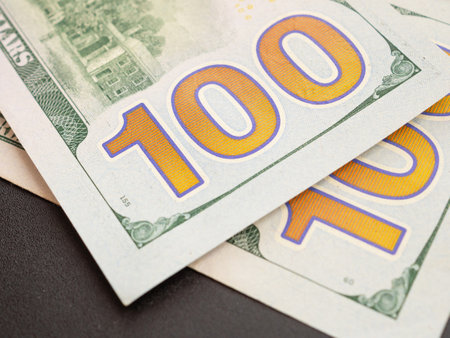 Close up, back side number 100 of American one hundred dollar bill on black background. Close up, selective focus.の写真素材