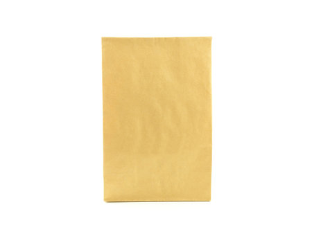 Front view of craft (brown) paper bag for packing products to take home, isolated on a white background. Eco-friendly lifestyle.の写真素材