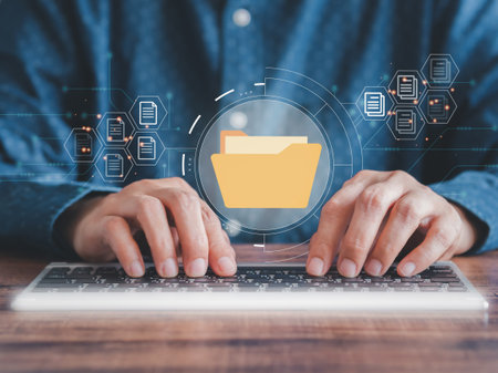 Businessman tpying keyboard show virtual screen icons Document Management System (DMS) working in the office, searching and managing files online document database. Internet technology concept. Digital security.の写真素材