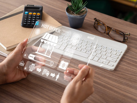 Users use the transparent tablet to view online shopping discounts hot offers. The concept of purchasing and selling products and services online.の写真素材