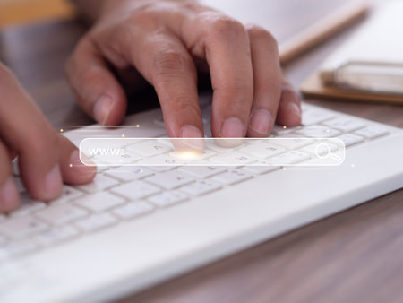 Man's typing keyboard to searching browsing Internet data information. Search Engine Optimization...